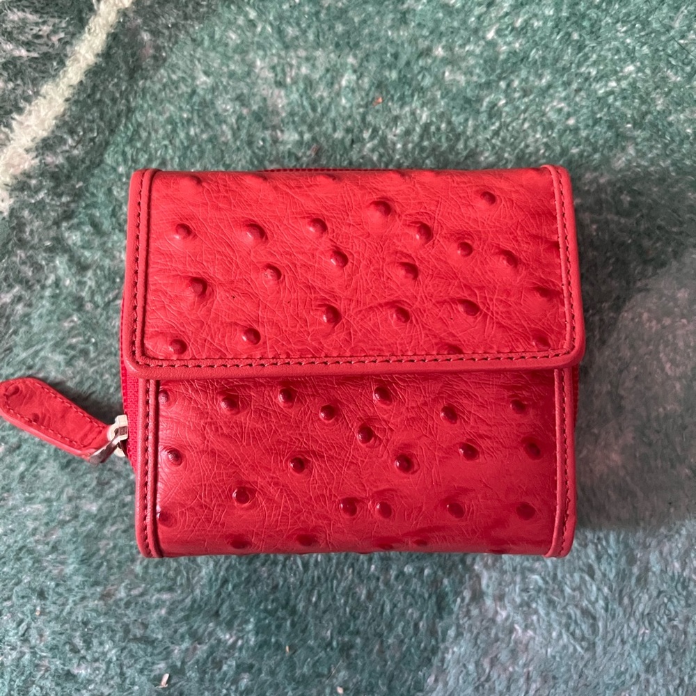Pink “ostrich” genuine leather wallet.